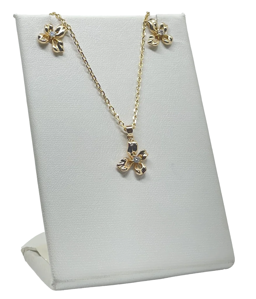Set collar y aretes dorado de rodio con dije de flor